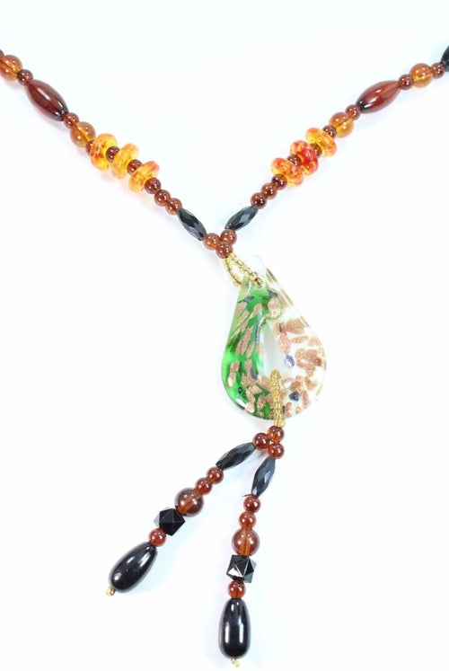 Necklace with colorful beads and a central green teardrop-shaped pendant on a white background